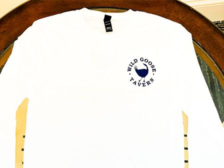 This image shows a white long-sleeve shirt with a logo that reads 